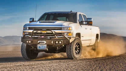 WARN Ascent Prerunner Grille Guard Tube for 2011-2018 Ram 2500/3500 front bumper shown on a dry lakebed