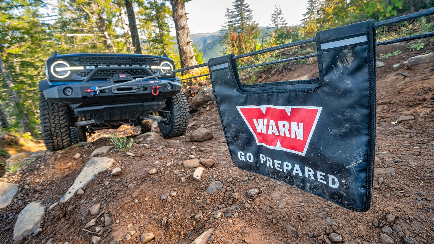 WARN Winch Line Damper winch cable damper shown on a dirt trail