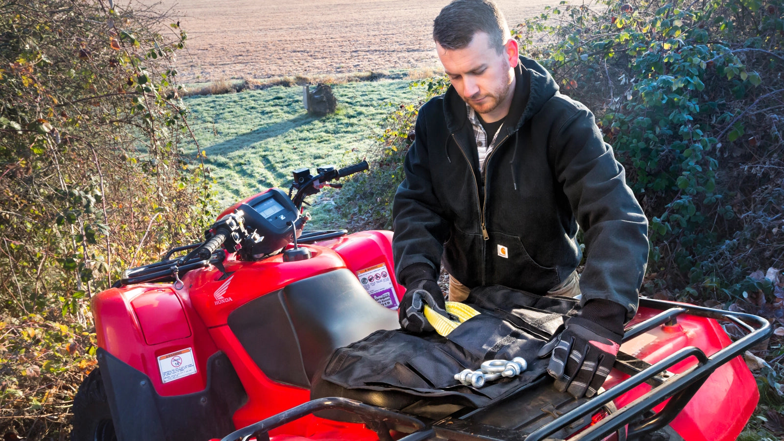WARN Tool Roll Recovery Kit winch rigging kit shown in an open field