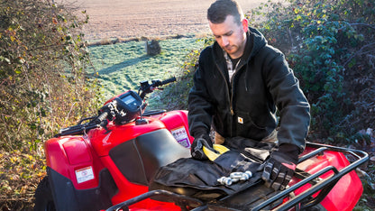 WARN Tool Roll Recovery Kit winch rigging kit shown in an open field