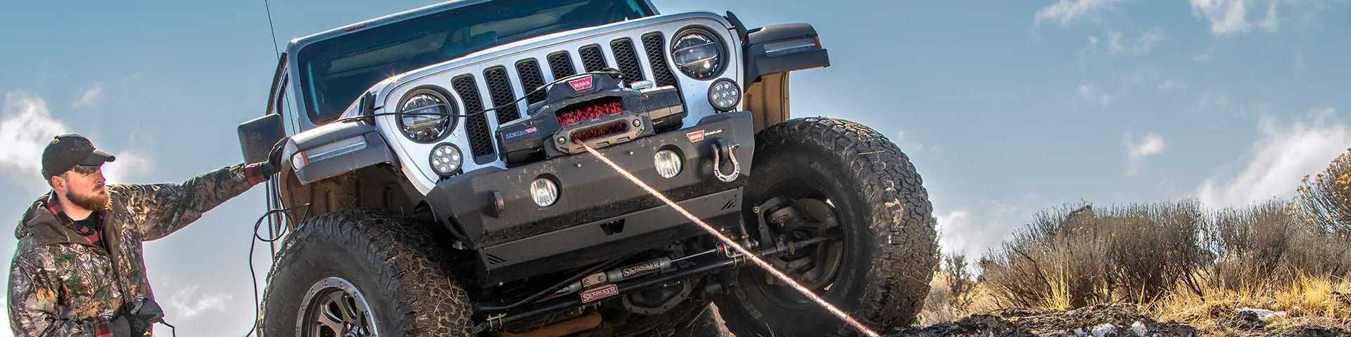 WARN Lend Us Your Rig program banner featuring off-road vehicle